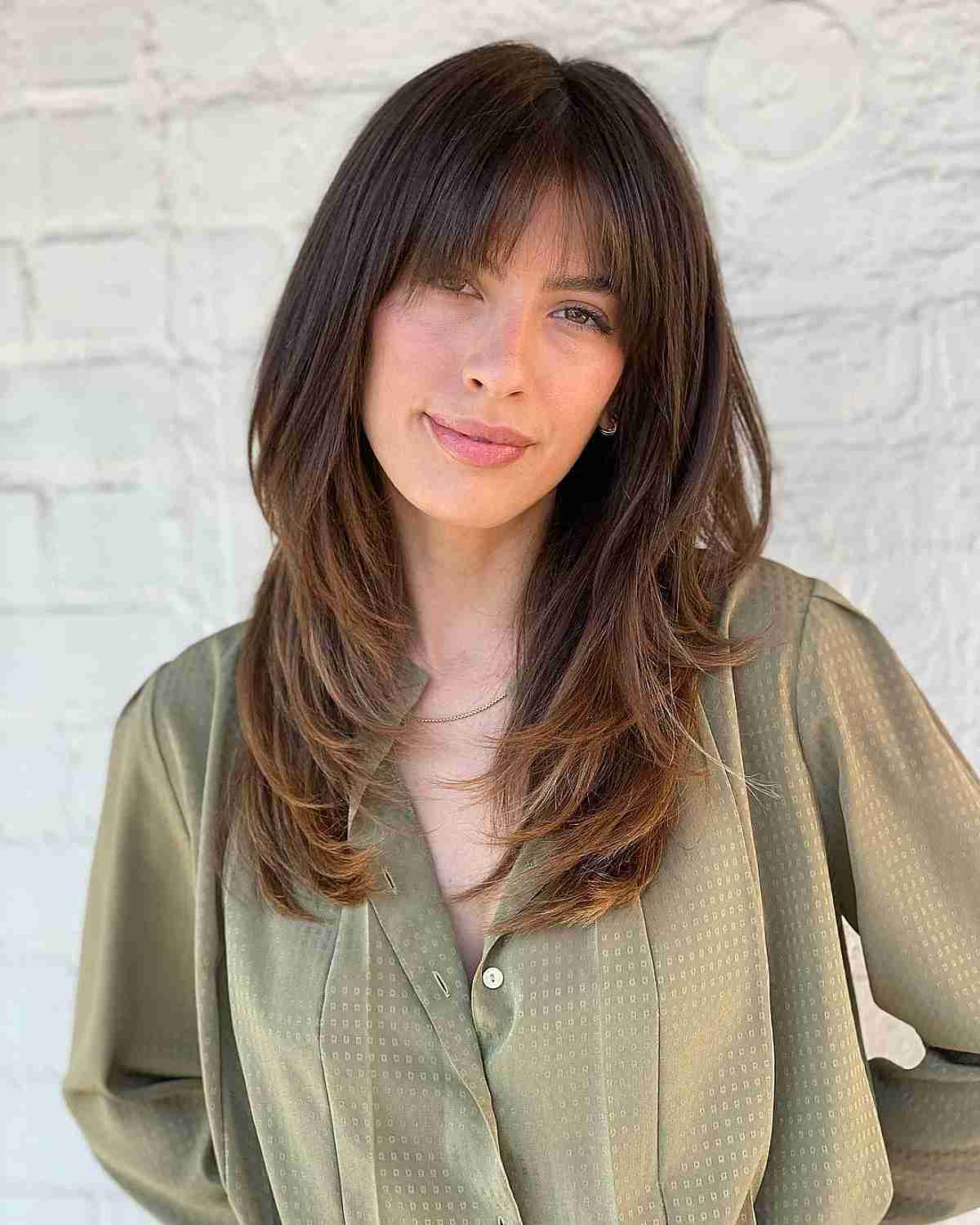 Straight Blowout Style with Bardot Bangs for Oval Face Shapes
