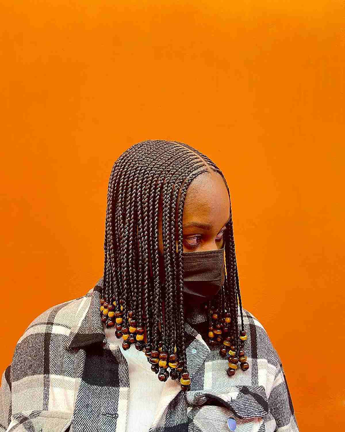 Mid-length box braids with beads