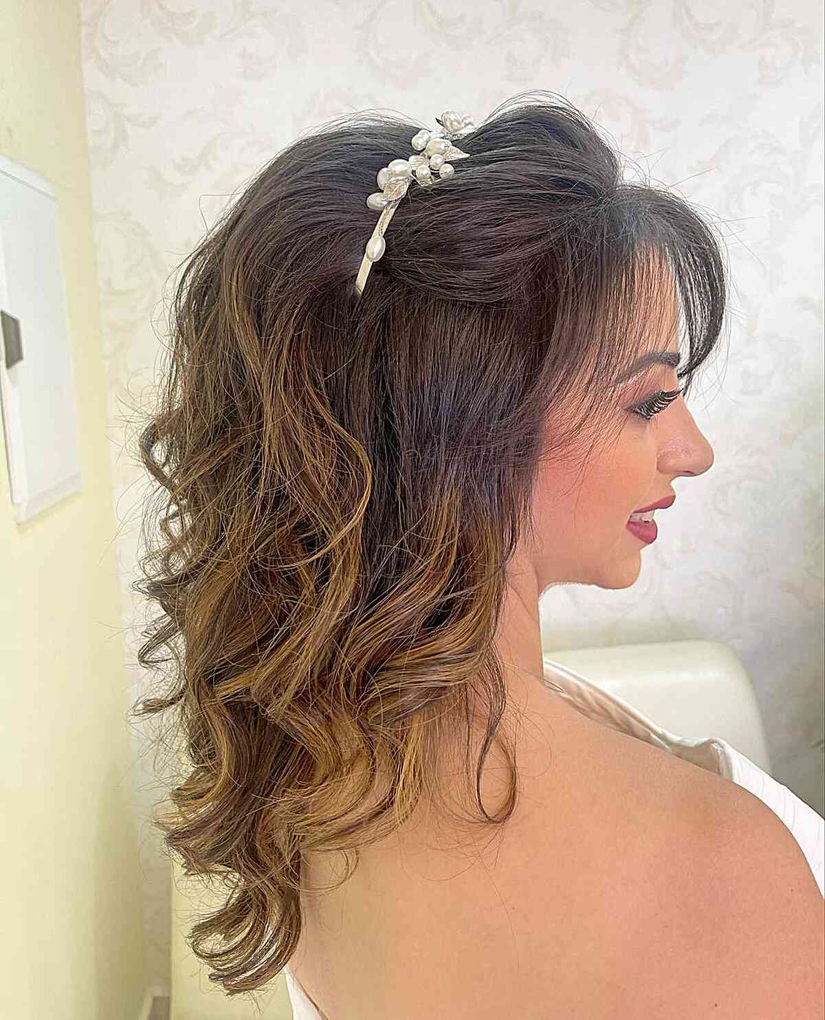 Beautiful Half Updo Featuring Side-Swept Bangs