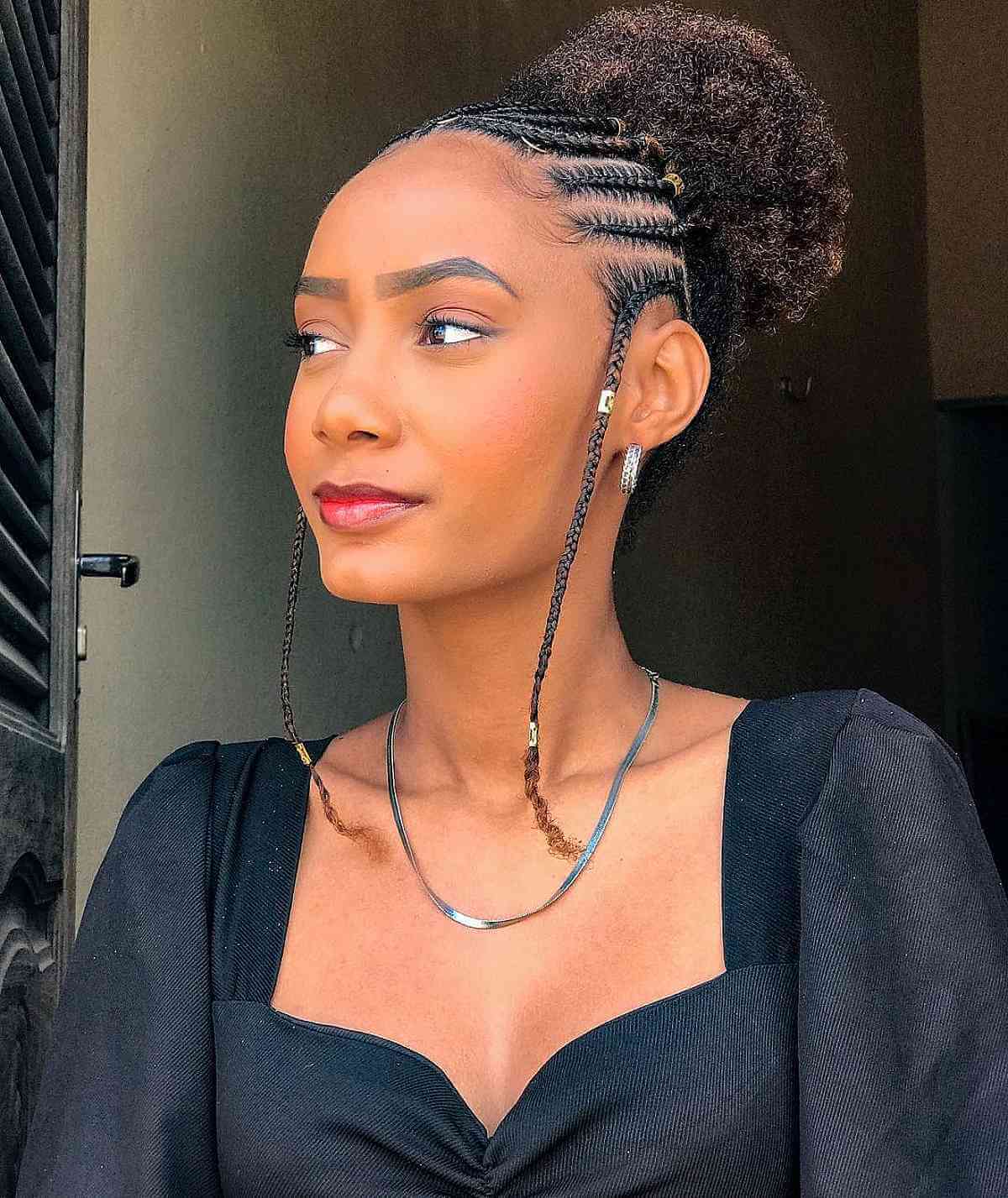 Beautiful High Bun Featuring Fulani Braids