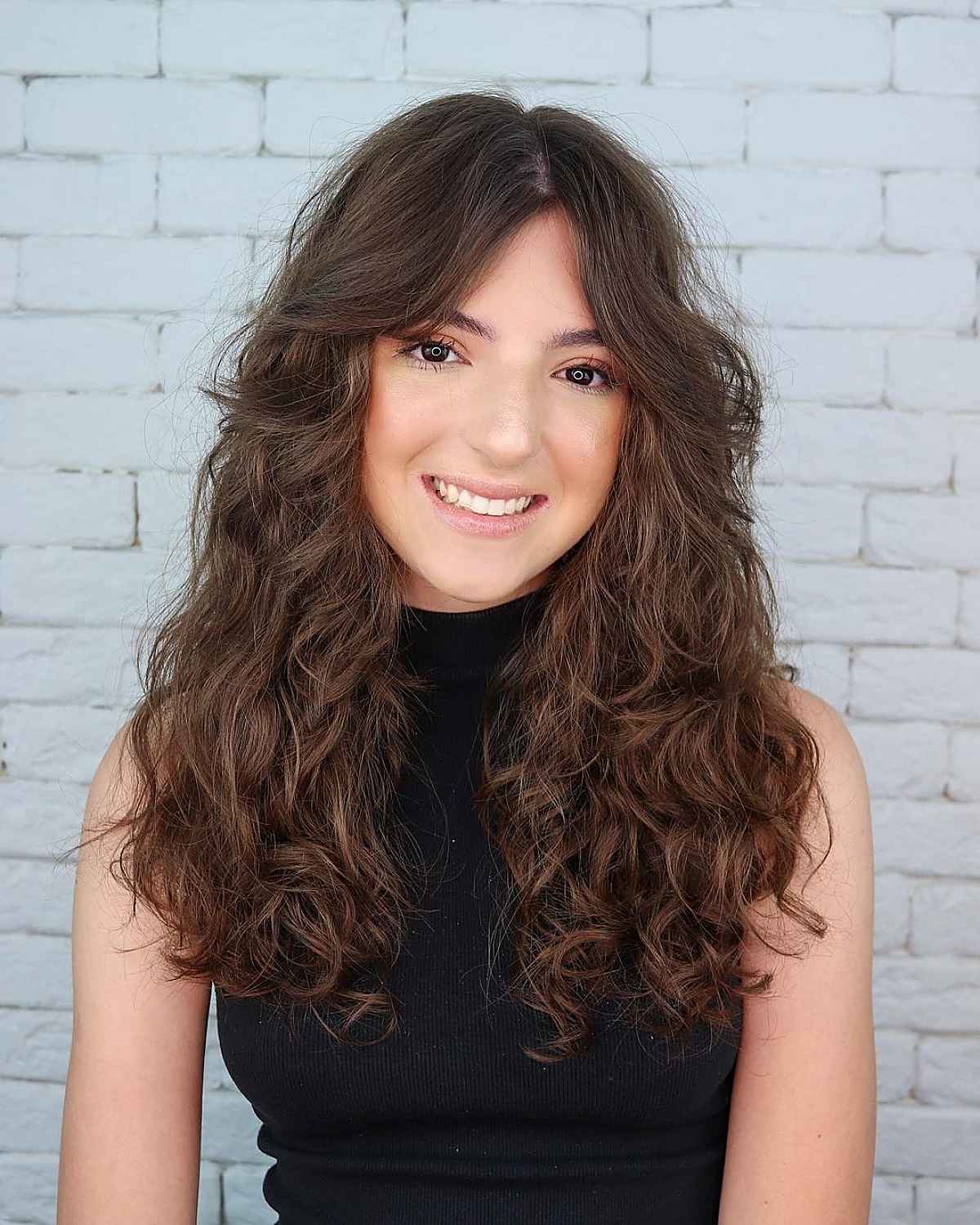 beautiful long curly hair with a center part