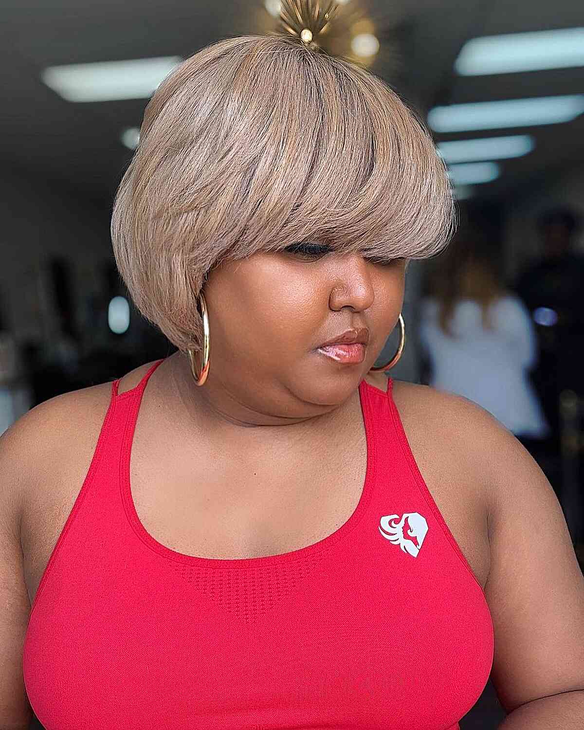Beige blonde bob haircut for voluminous hair and women with double chins