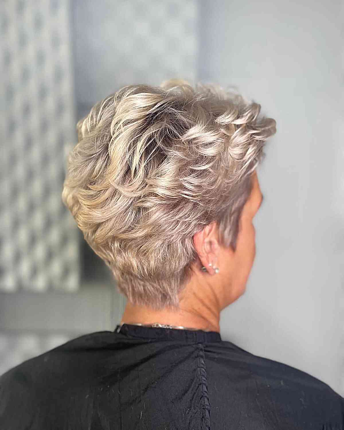 Blonde Feathered Pixie with Tapered Nape and Short Layers