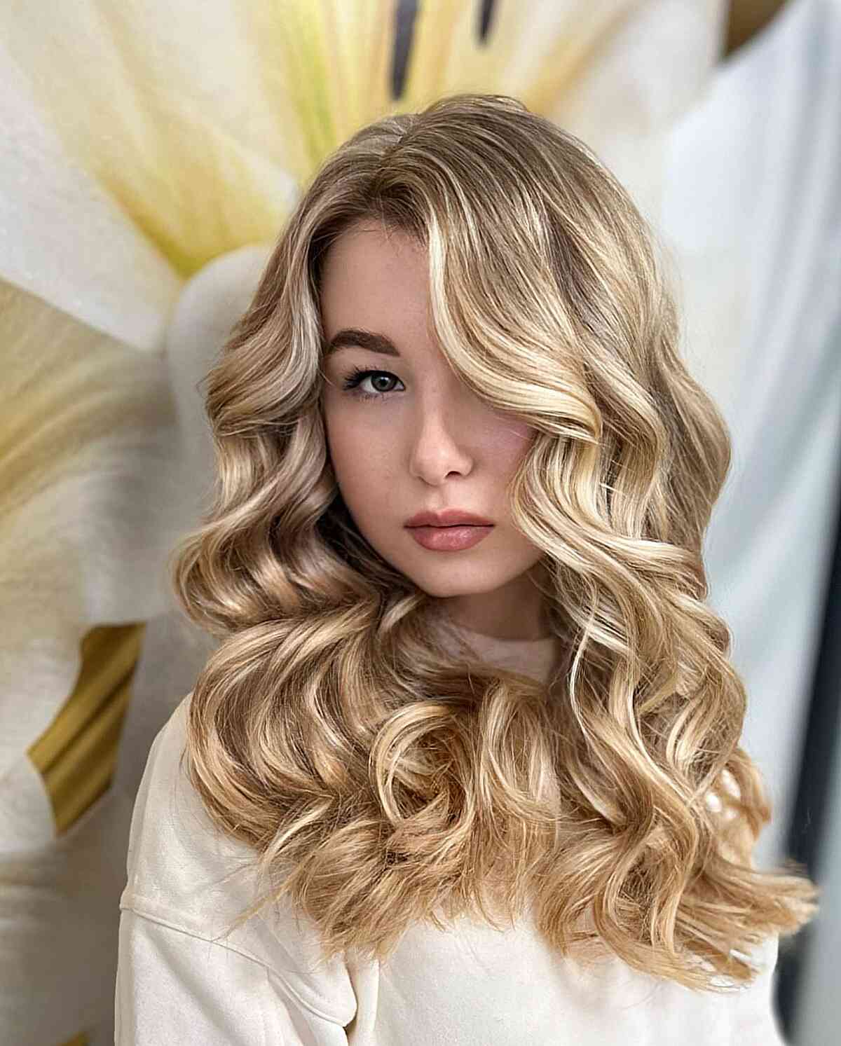 Blonde Balayage with Dark Roots Curled Hairstyle featuring a side part