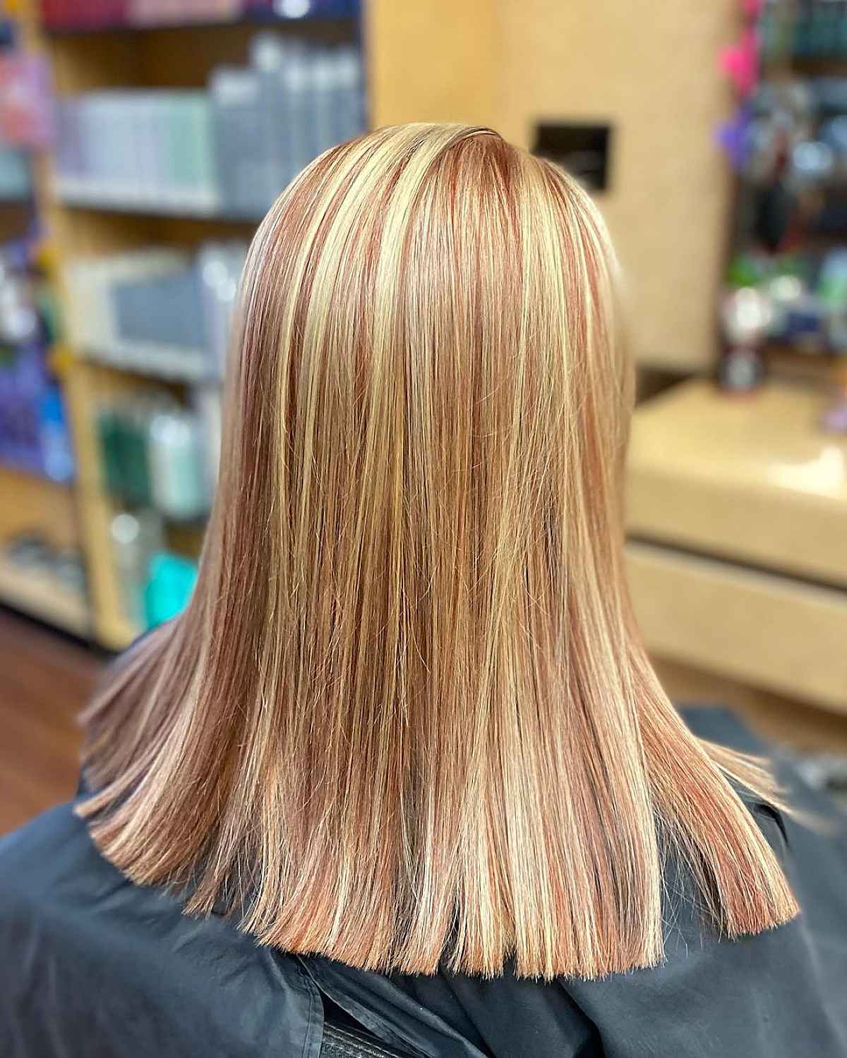 Blonde Locks with Subtle Red Lowlights Below