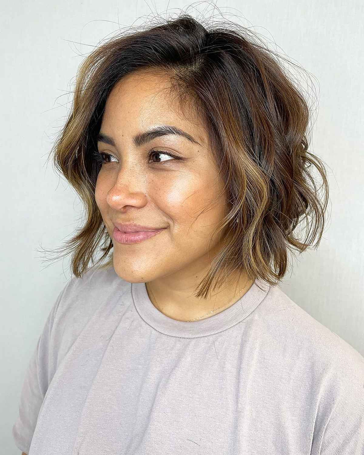 Bob Hairstyle with Soft Waves and Side Part