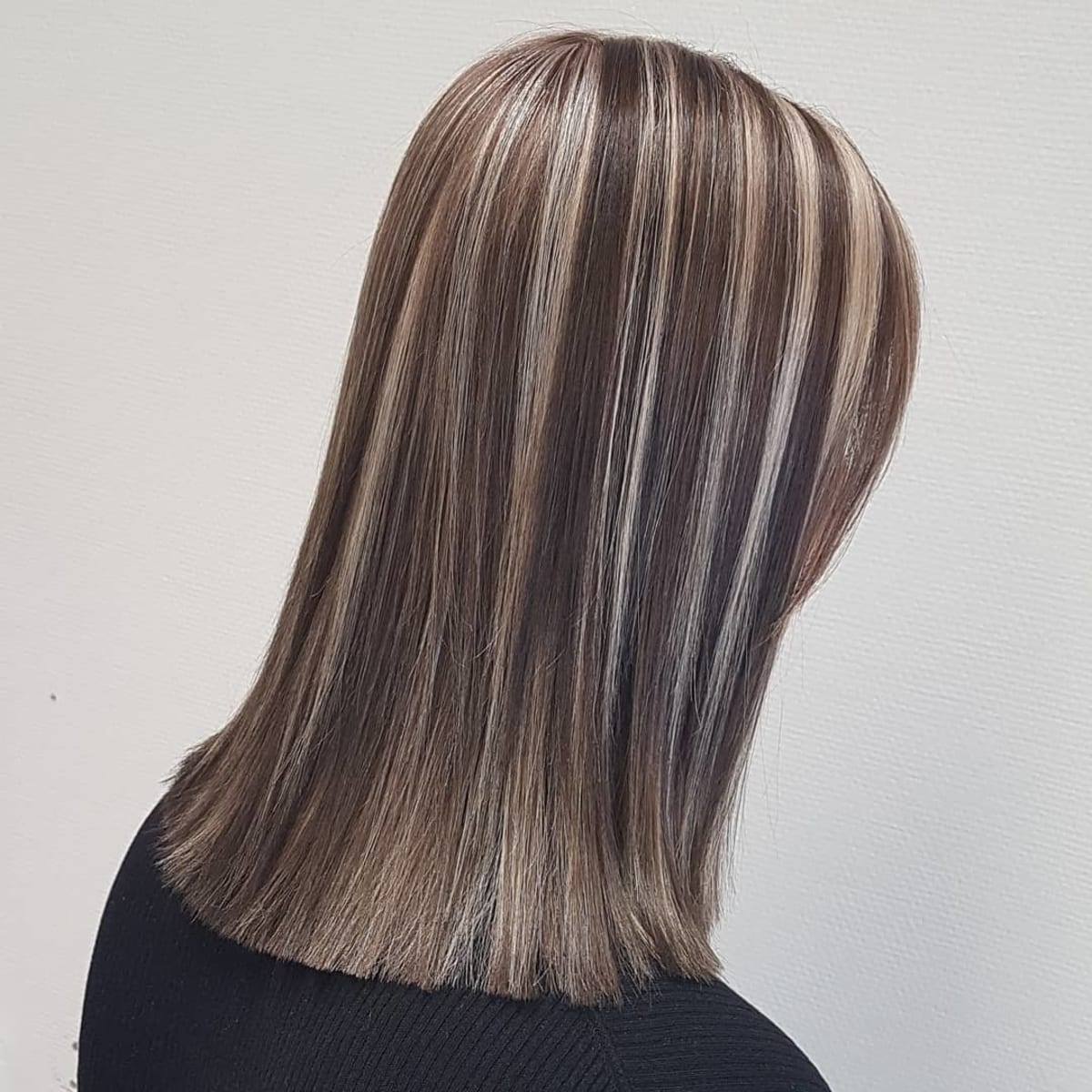 Bold blonde highlights on a brunette base