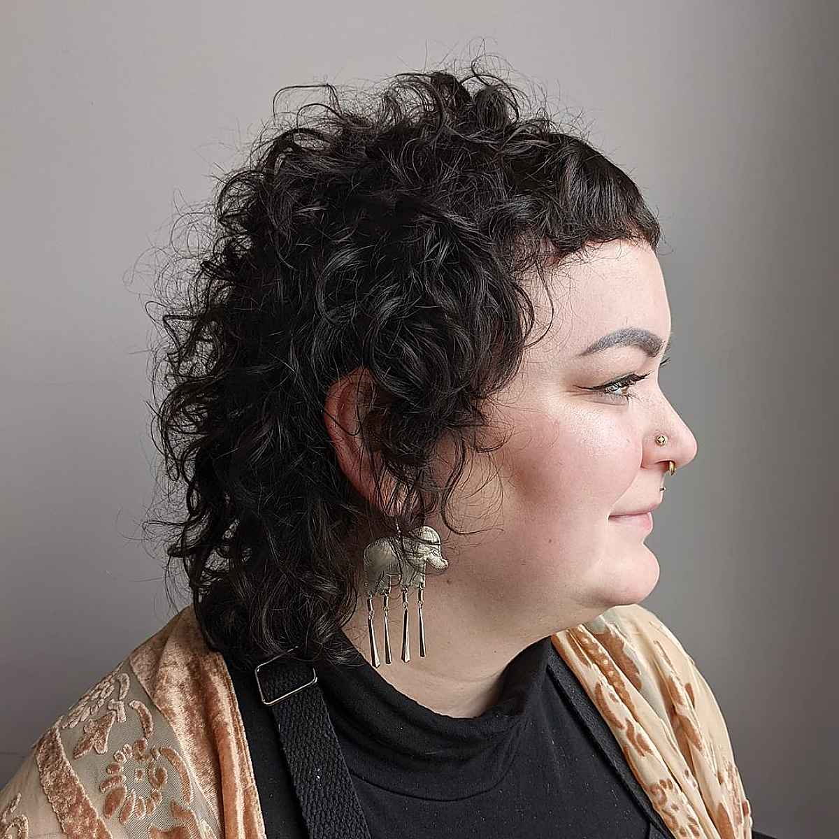 Bold Curly Shag Mullet with Micro Bangs
