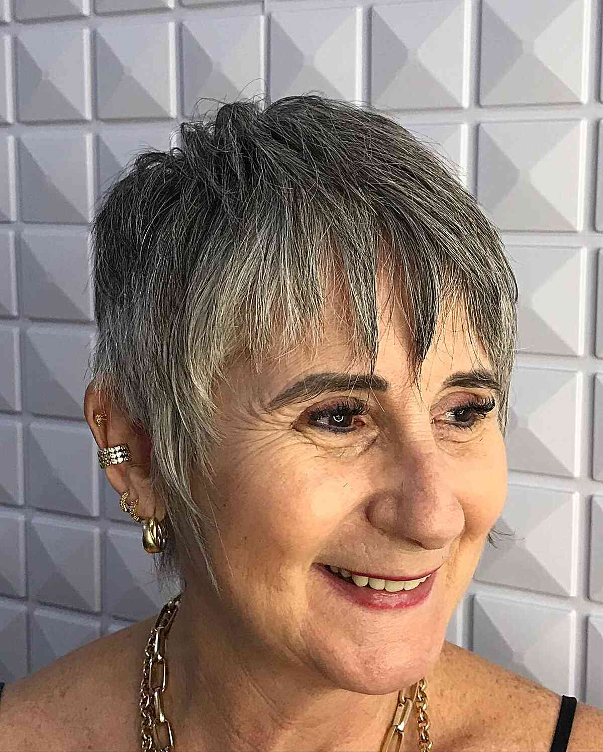 Bold Grey Pixie Cut with Textured Bangs for Mature Ladies