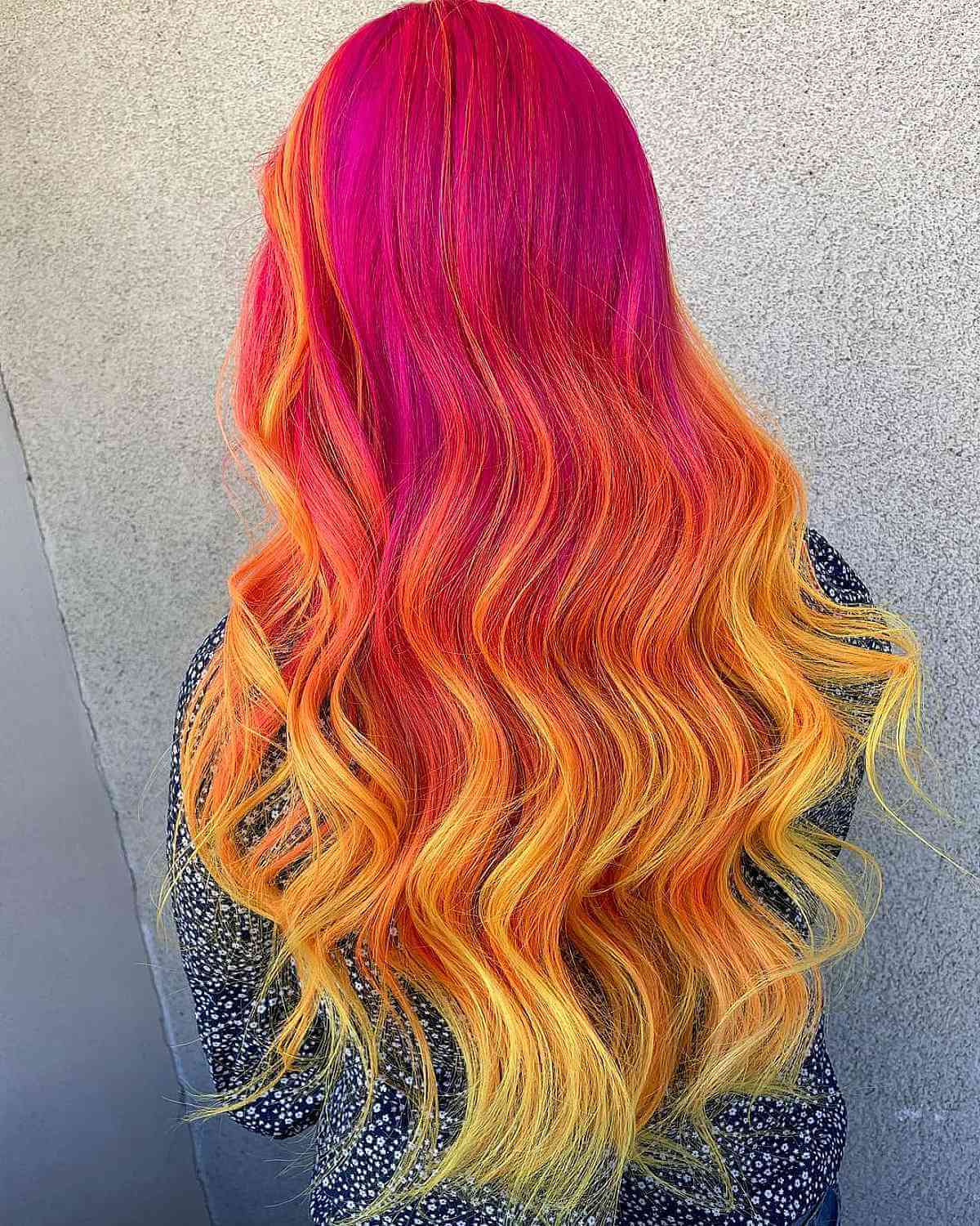 Bold Magenta Roots Transitioning to Orange-Yellow Tips Color Idea