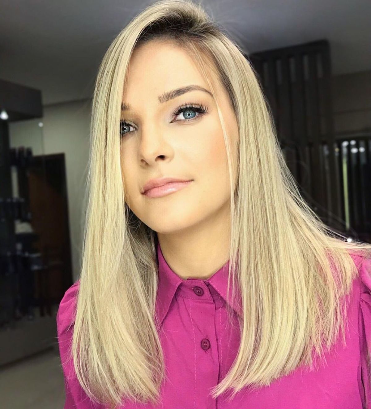 Bold Side Part on Sleek, Medium-Length Hair