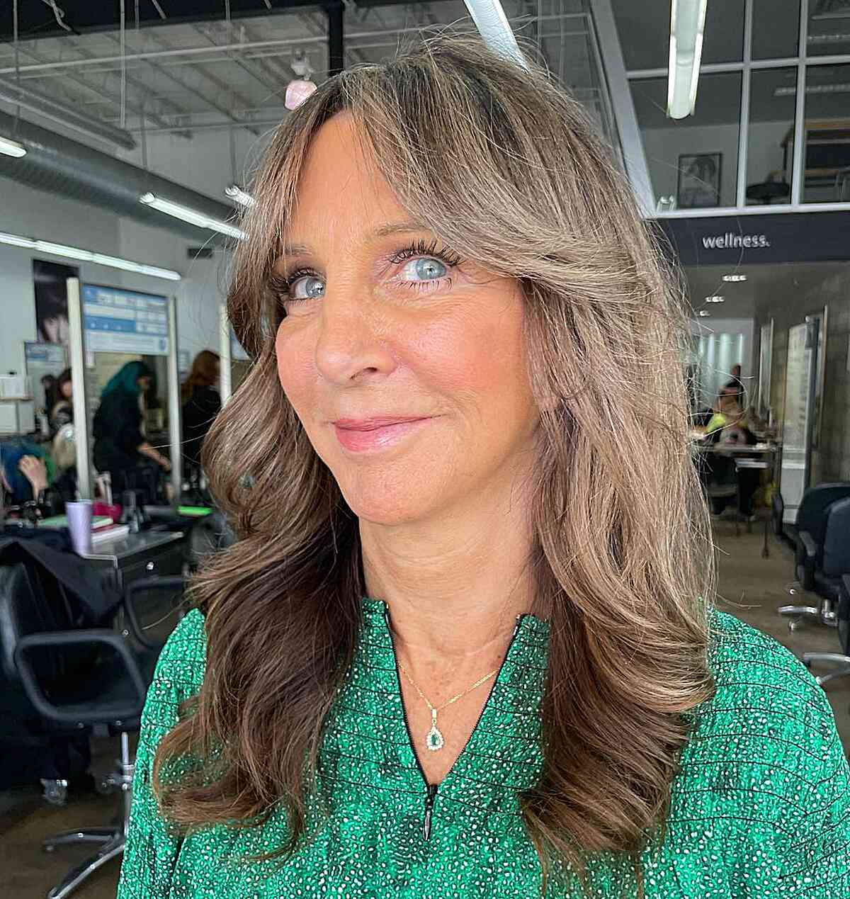 Mid-Length Bouncy Butterfly Hairstyle with Curtain Bangs for Ladies Over 50