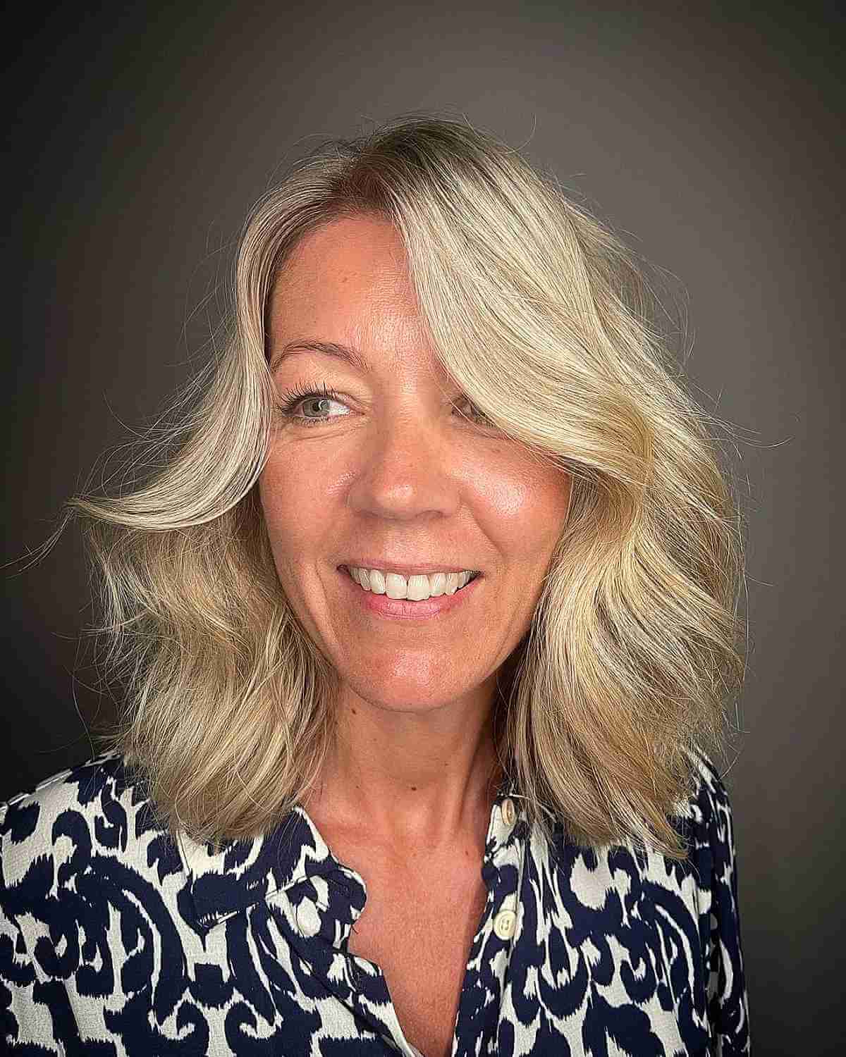 Bouncy Wavy Shoulder-Length Hair for a Lady Over Forty