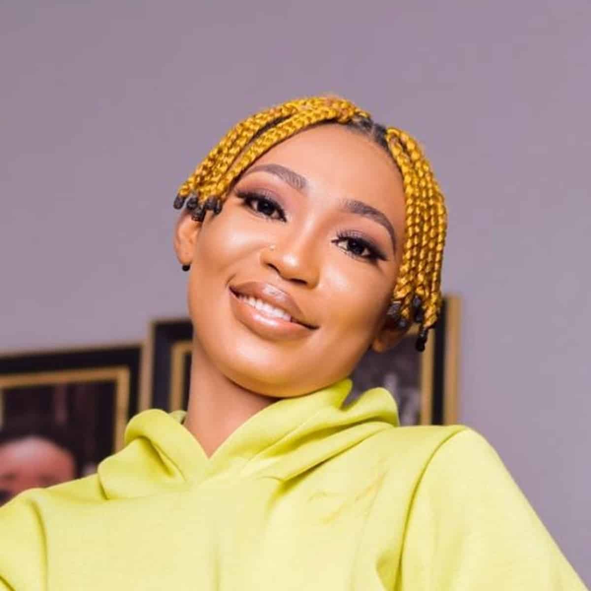 Box braids styled with a pixie cut