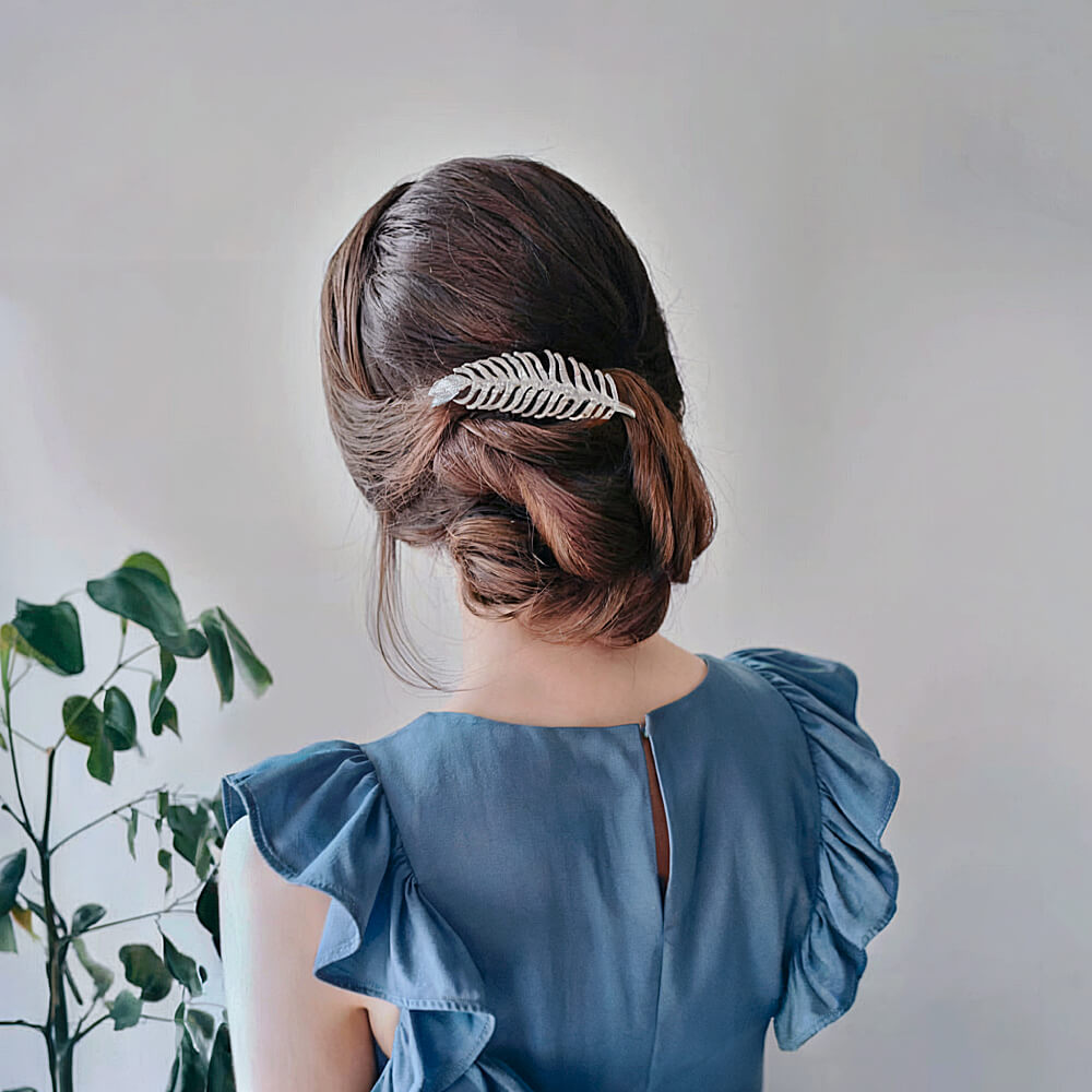 Bun with Twists and Feathered Hair Accessory