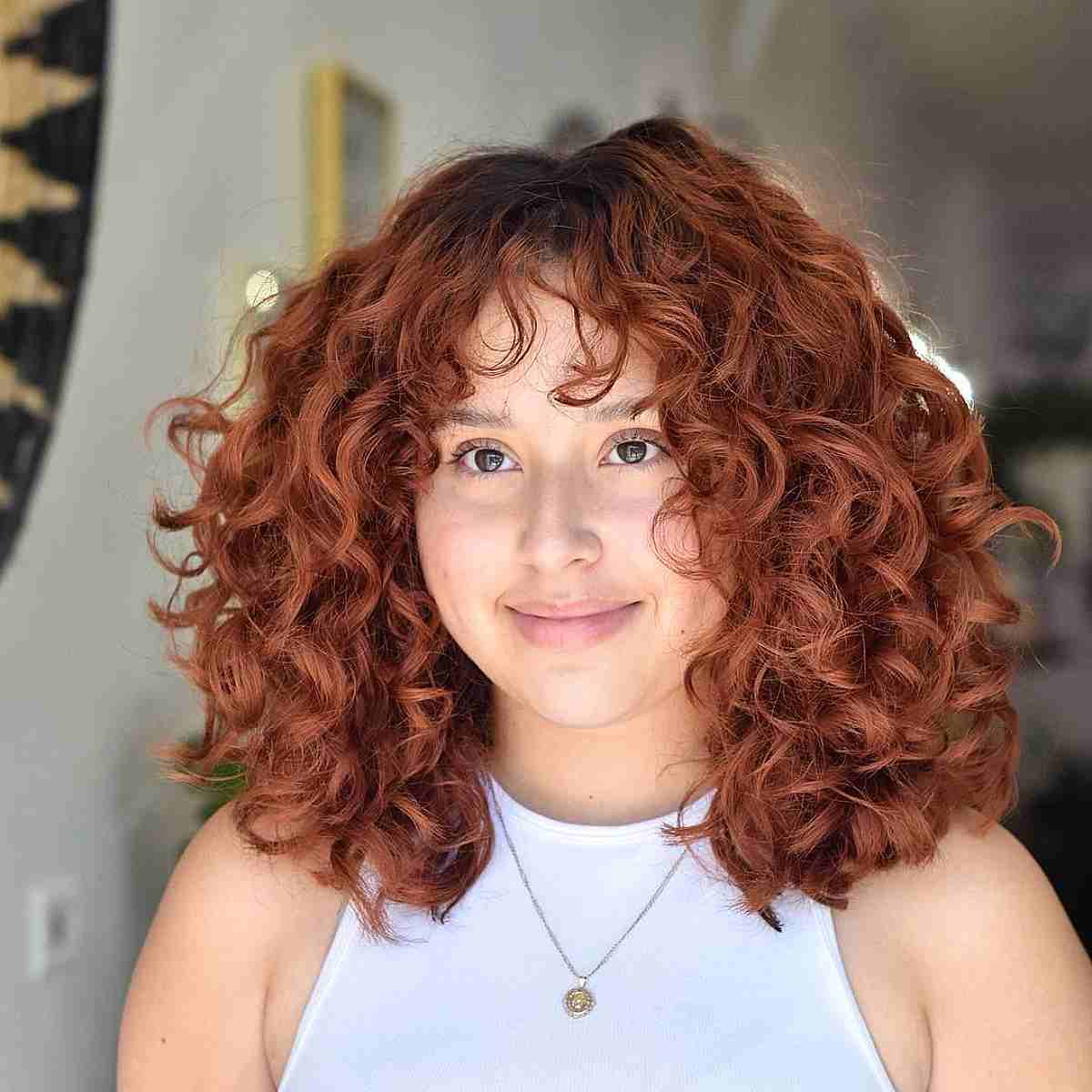 Cascading Red Curls with Soft Bangs