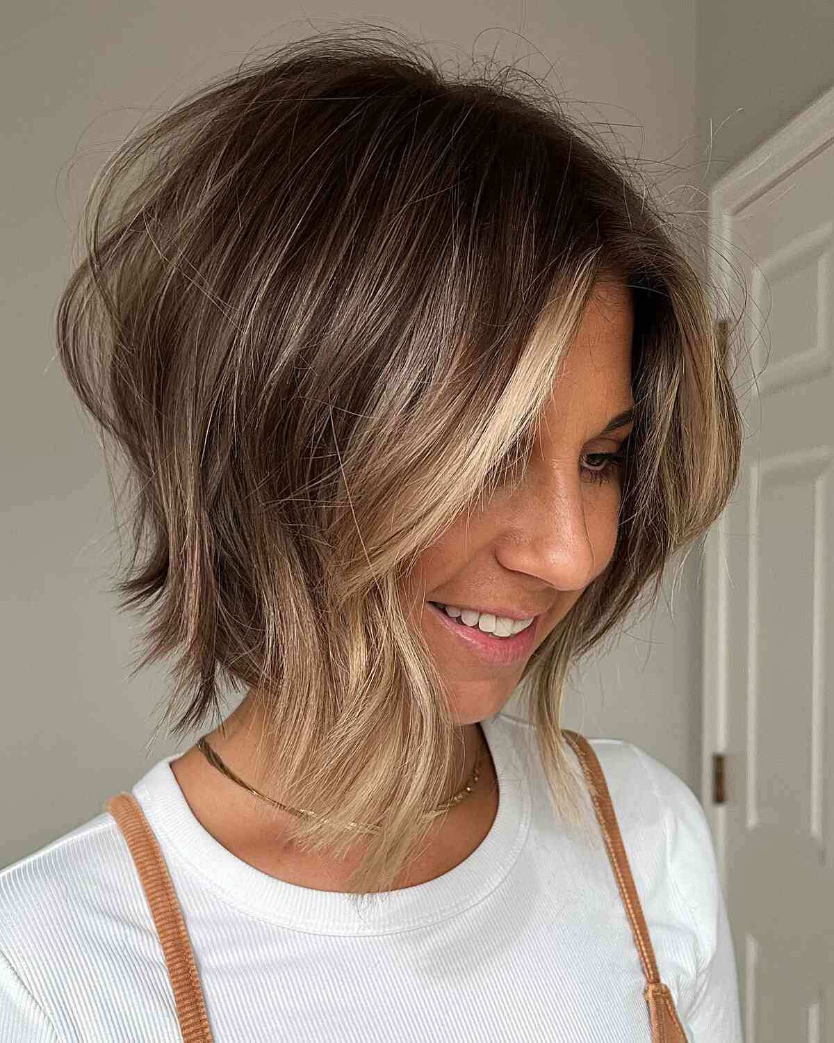 Short Casual Brunette Layered Bob with Highlighted Accent and Choppy Ends for Thick Hair
