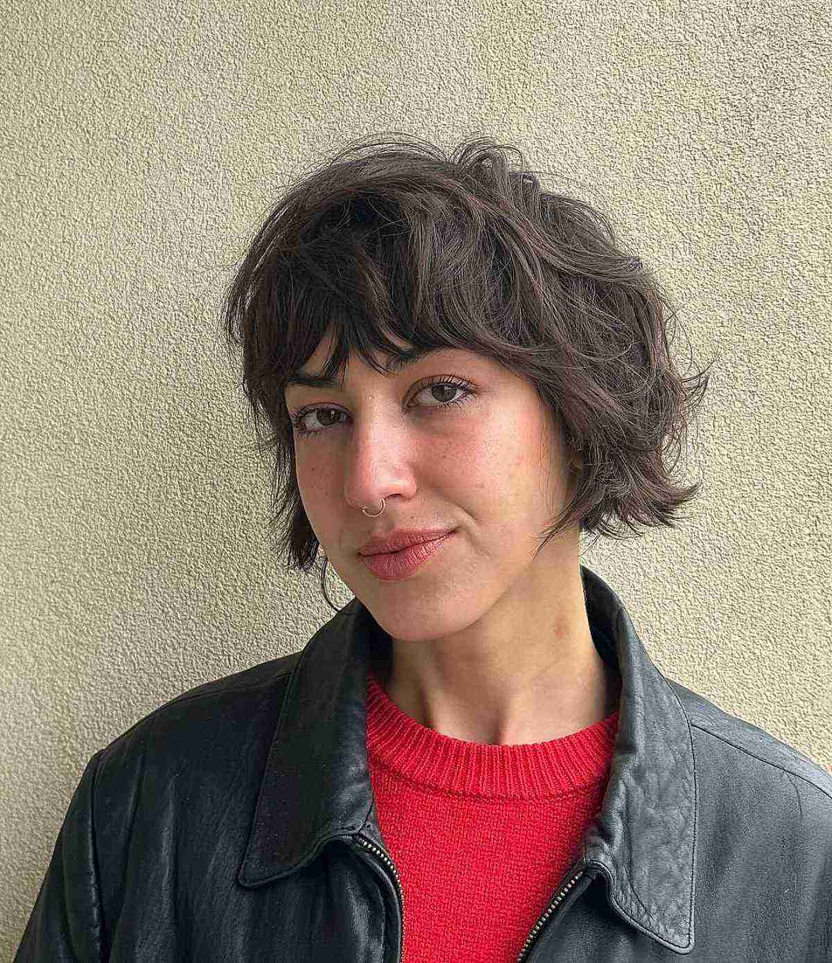 Casual layered bob haircut with texture-focused choppy bangs