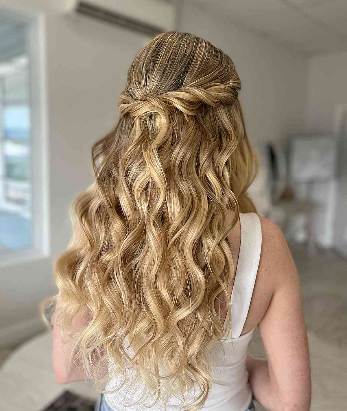 Charming Twisted Half-Down Style with Relaxed Curls for Long, Blonde Hair