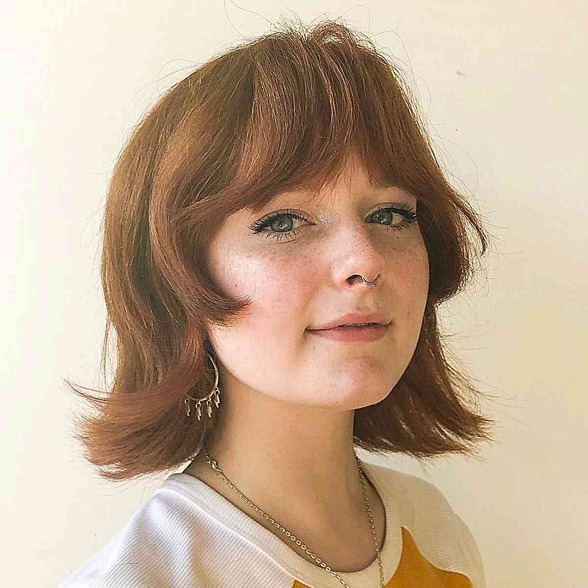 Charming Bottleneck Bangs with a Stylish Neck-Length Bob and flipped ends