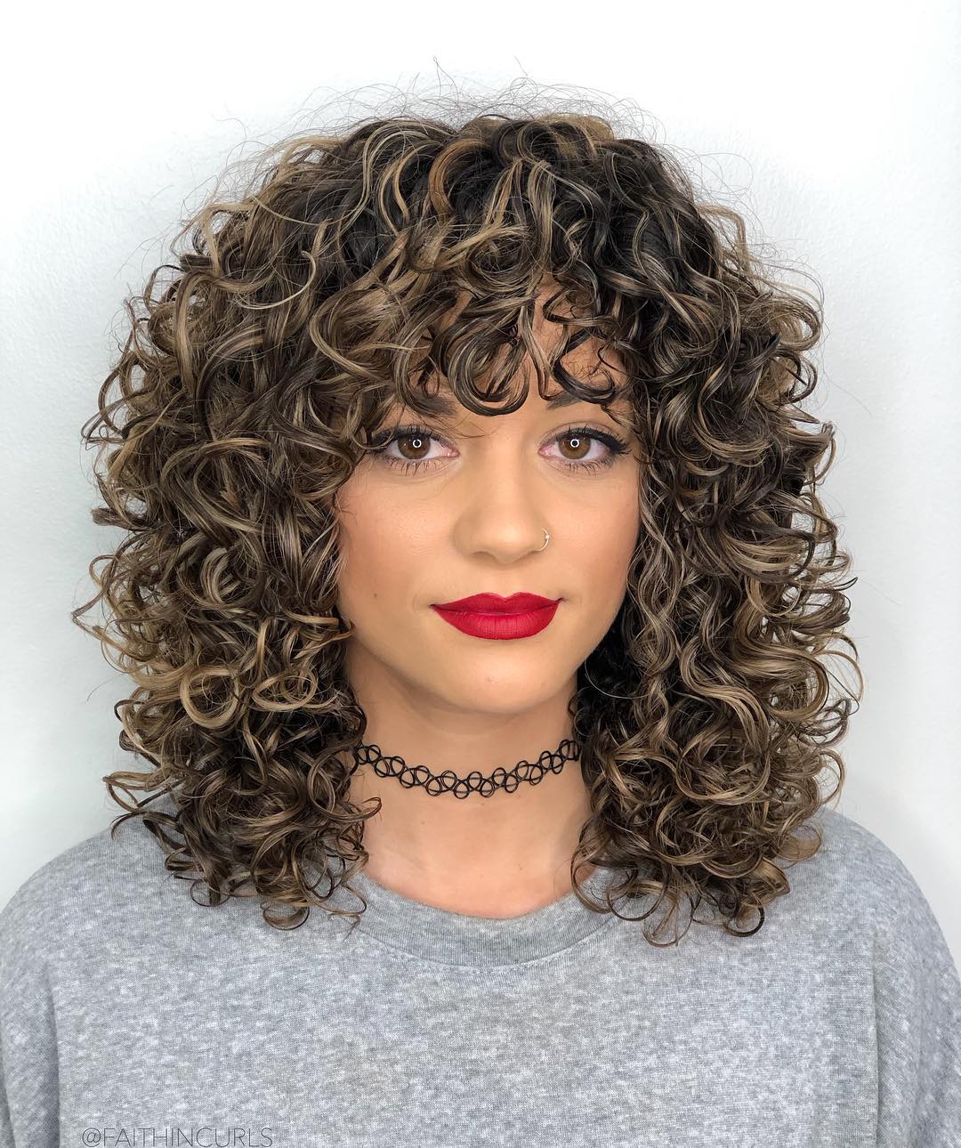 Charming Curls with Striking Bangs