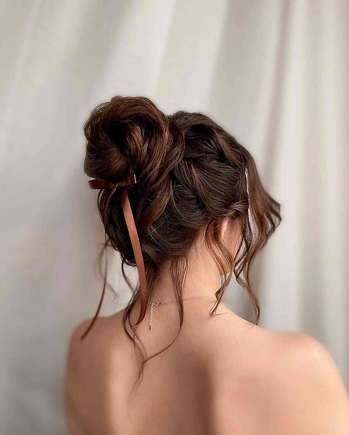 Charming High Bun with Accent Pieces Updo for Long Hair