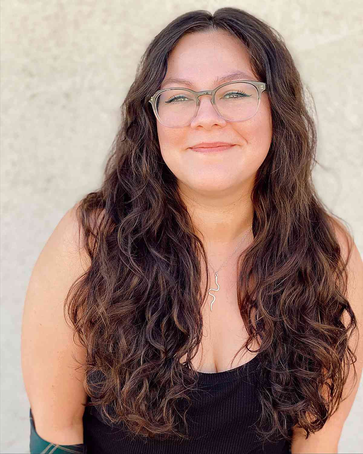 Charming long curly brown hair with a middle part