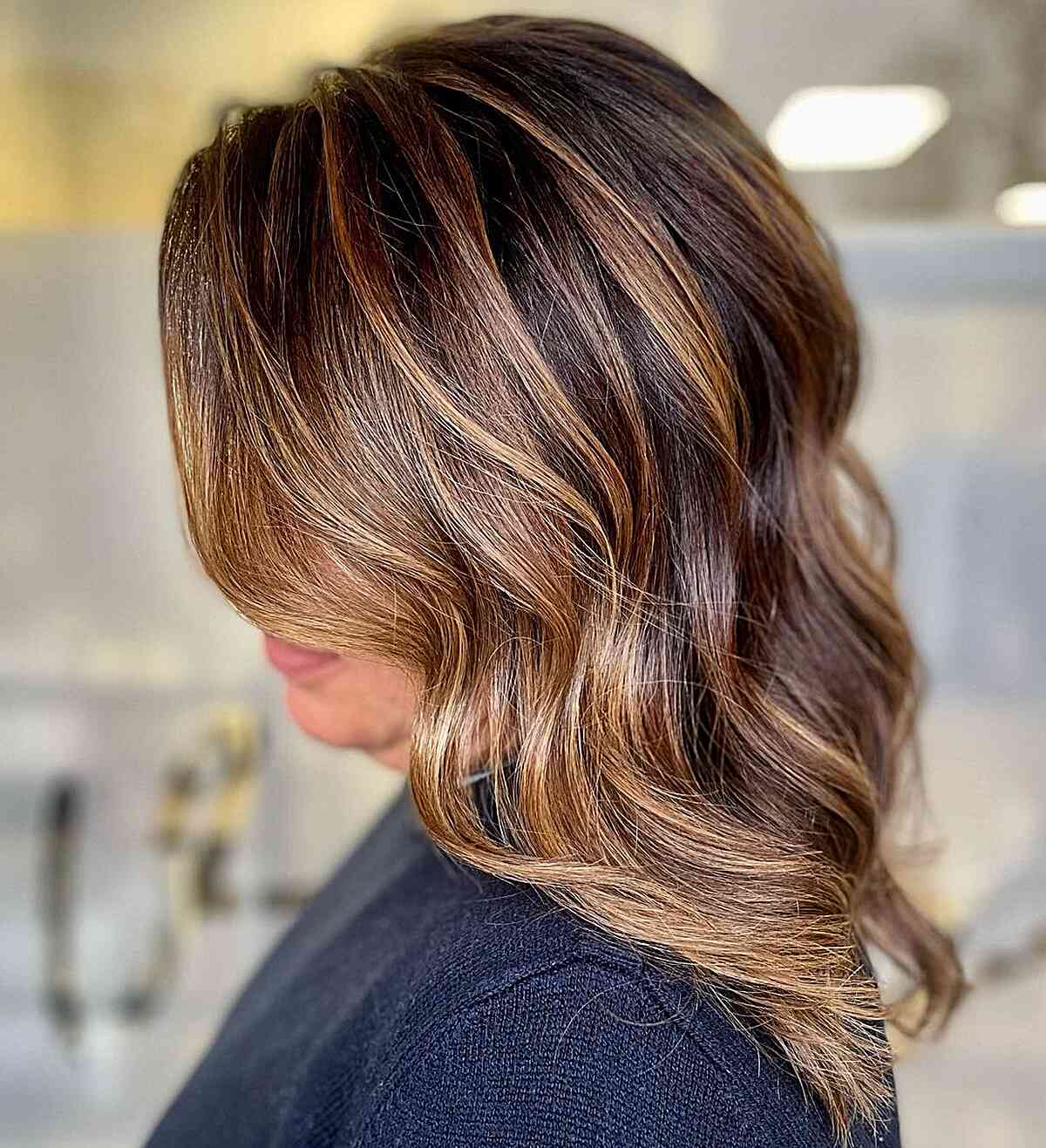 Mid-Length Chestnut Brown Hair Featuring Caramel Face-Framing Highlights and Layers