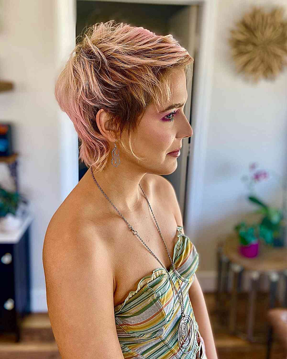 Chic and Textured Layered Long Pixie Cut for women with pink hair and dark roots