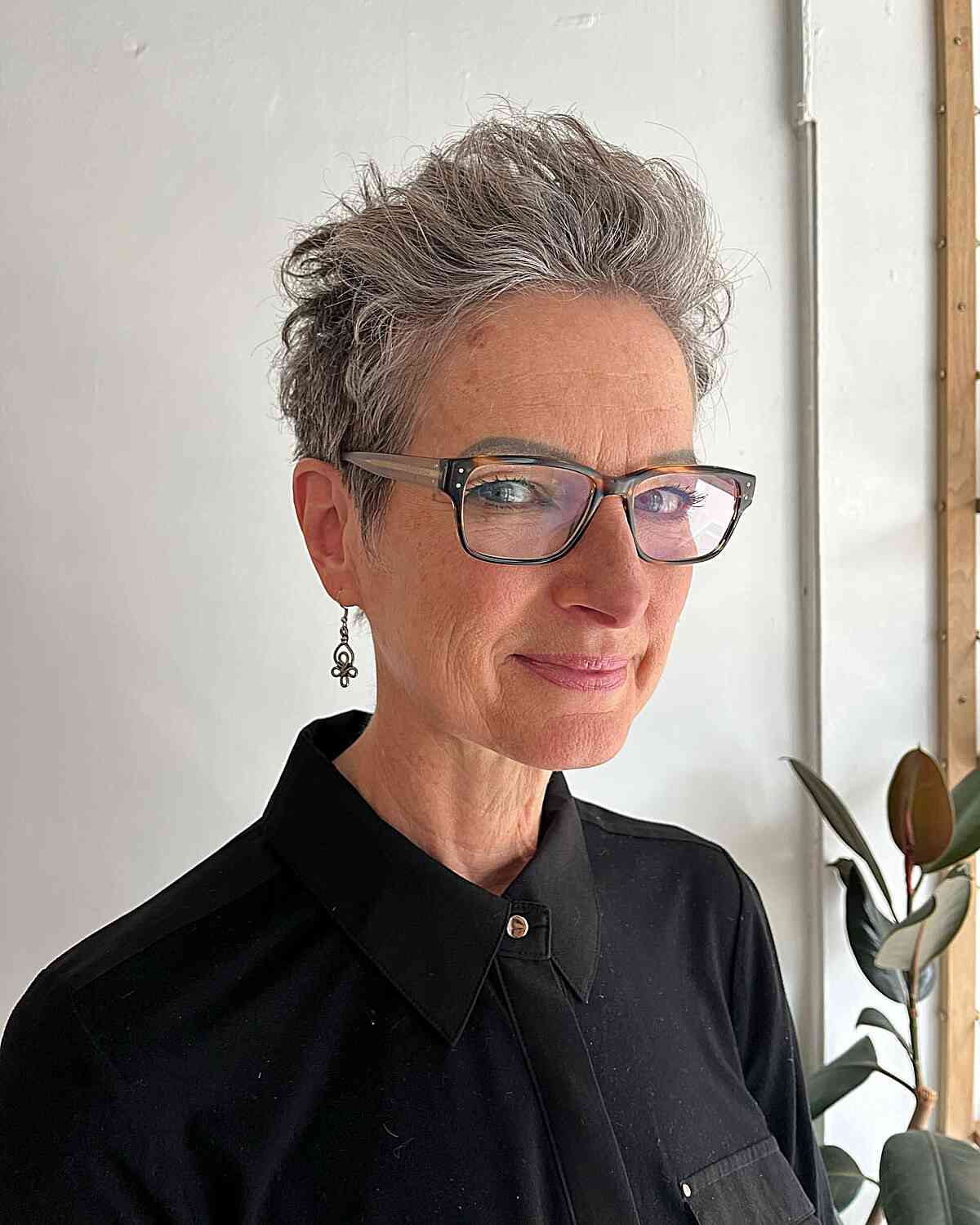 Chic and Textured Pixie Cut for Older Women with Glasses and Sideburns