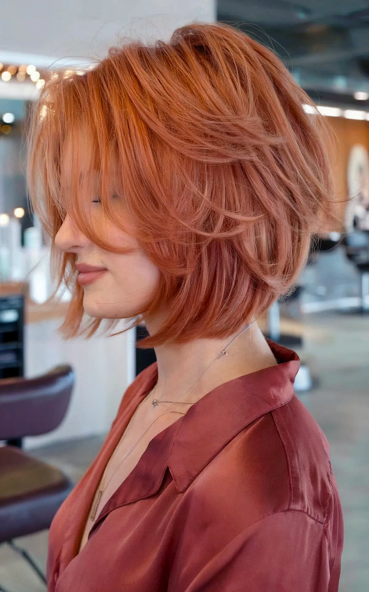 Chic Angled Copper Bob with Flowing Layers