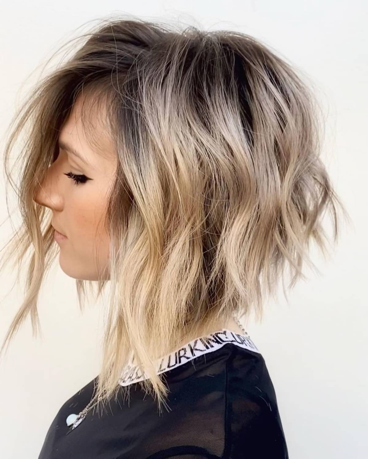 Chic angled haircut with blonde balayage