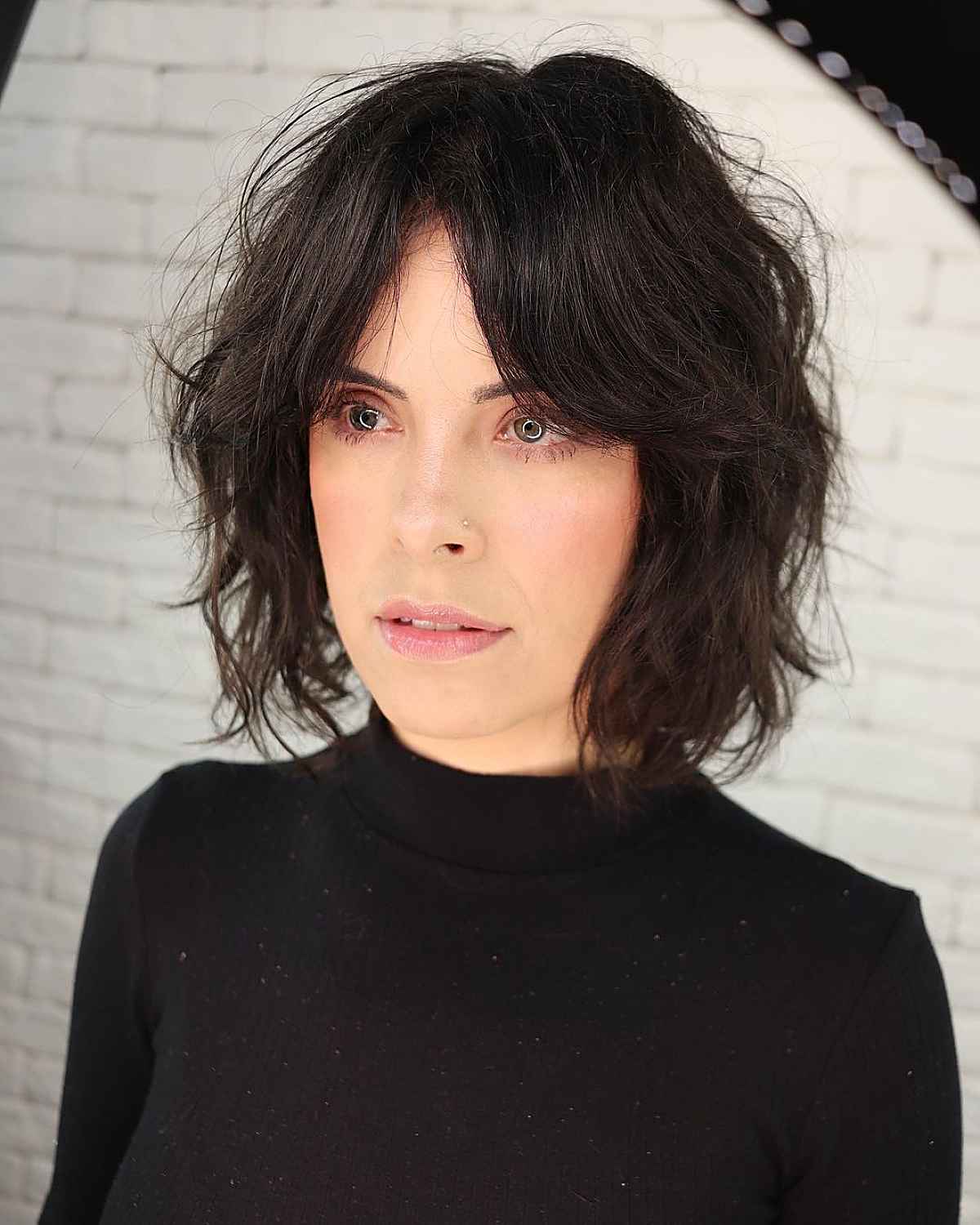 chic black shaggy cut without bangs