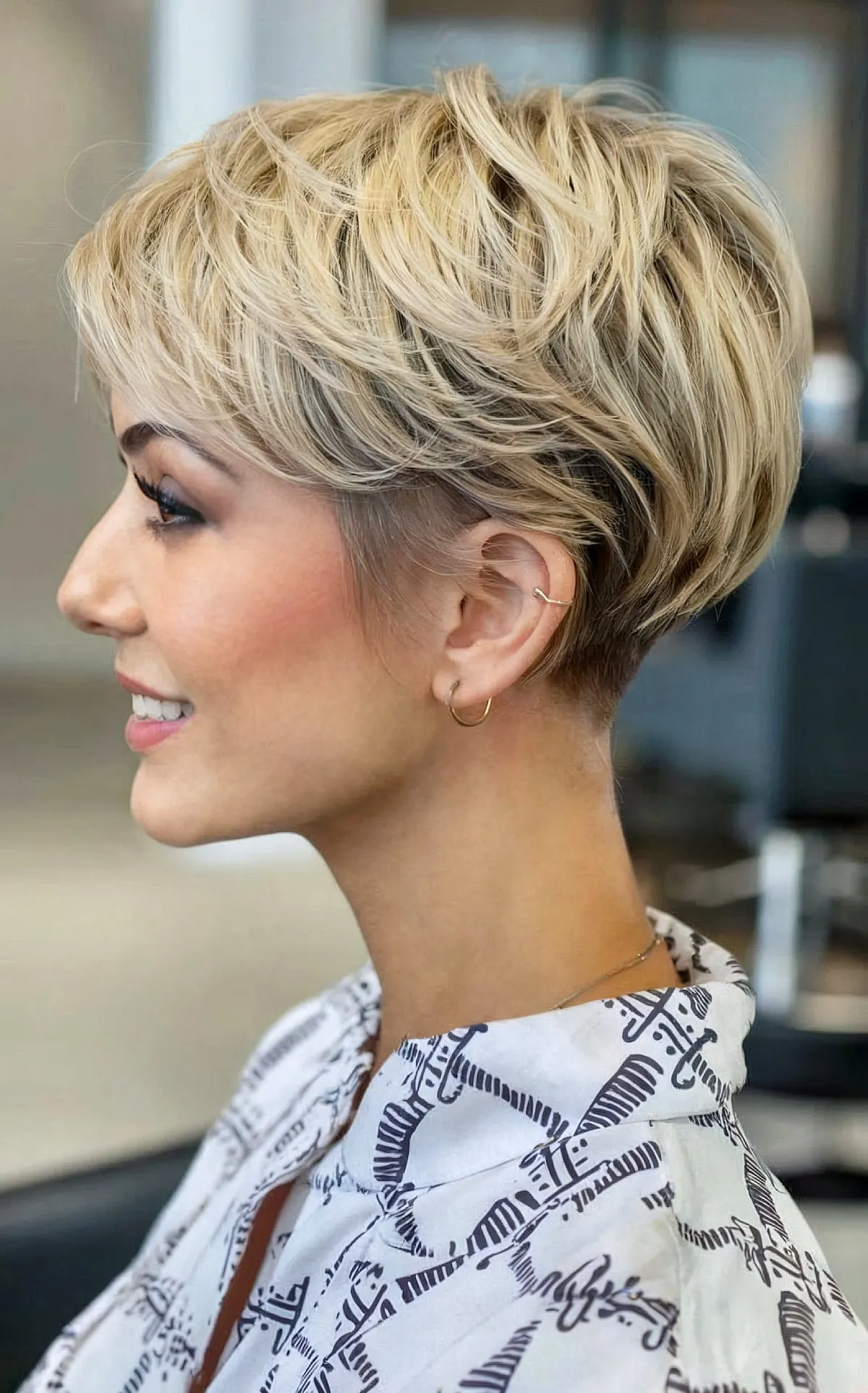 Chic Blonde Feathered Bob with a Tapered Neckline