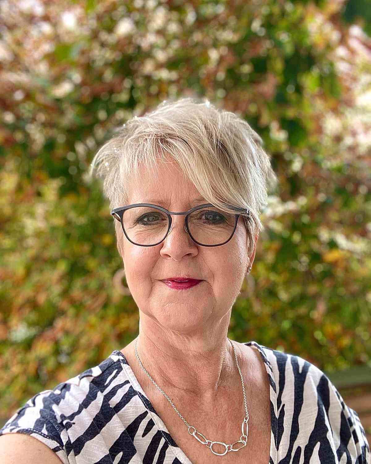 Chic Blonde Long Pixie with a Side Bang for Older Women with Glasses