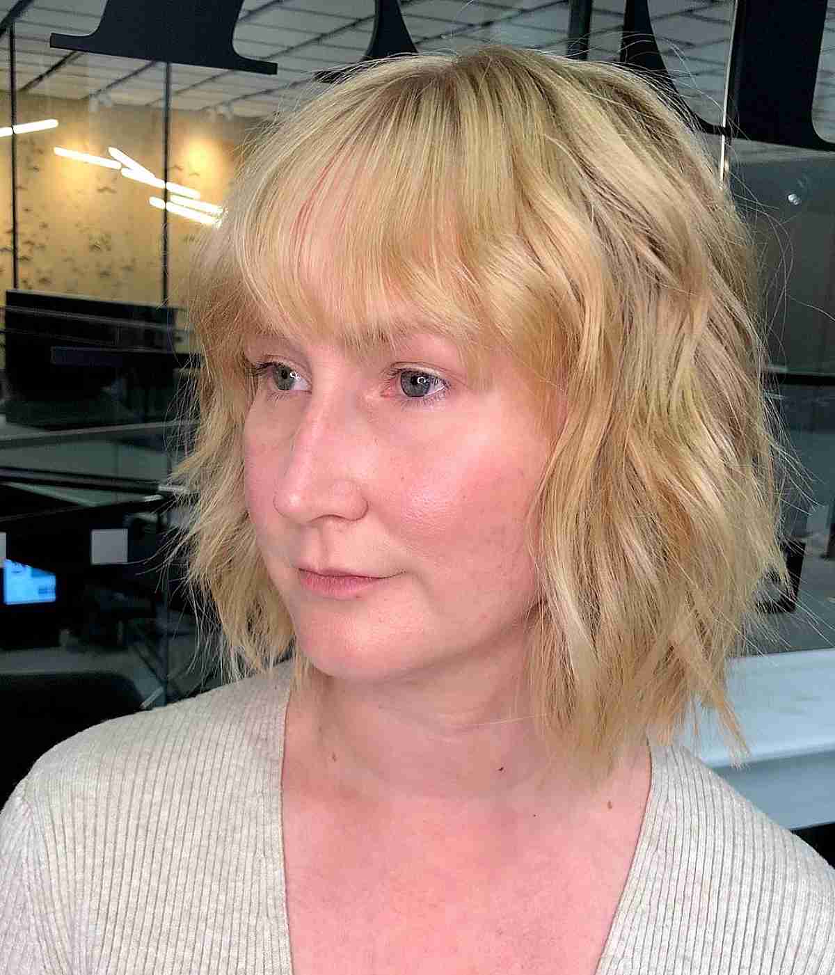 Chic Blonde Textured Bob with Bangs for Thinning Hair