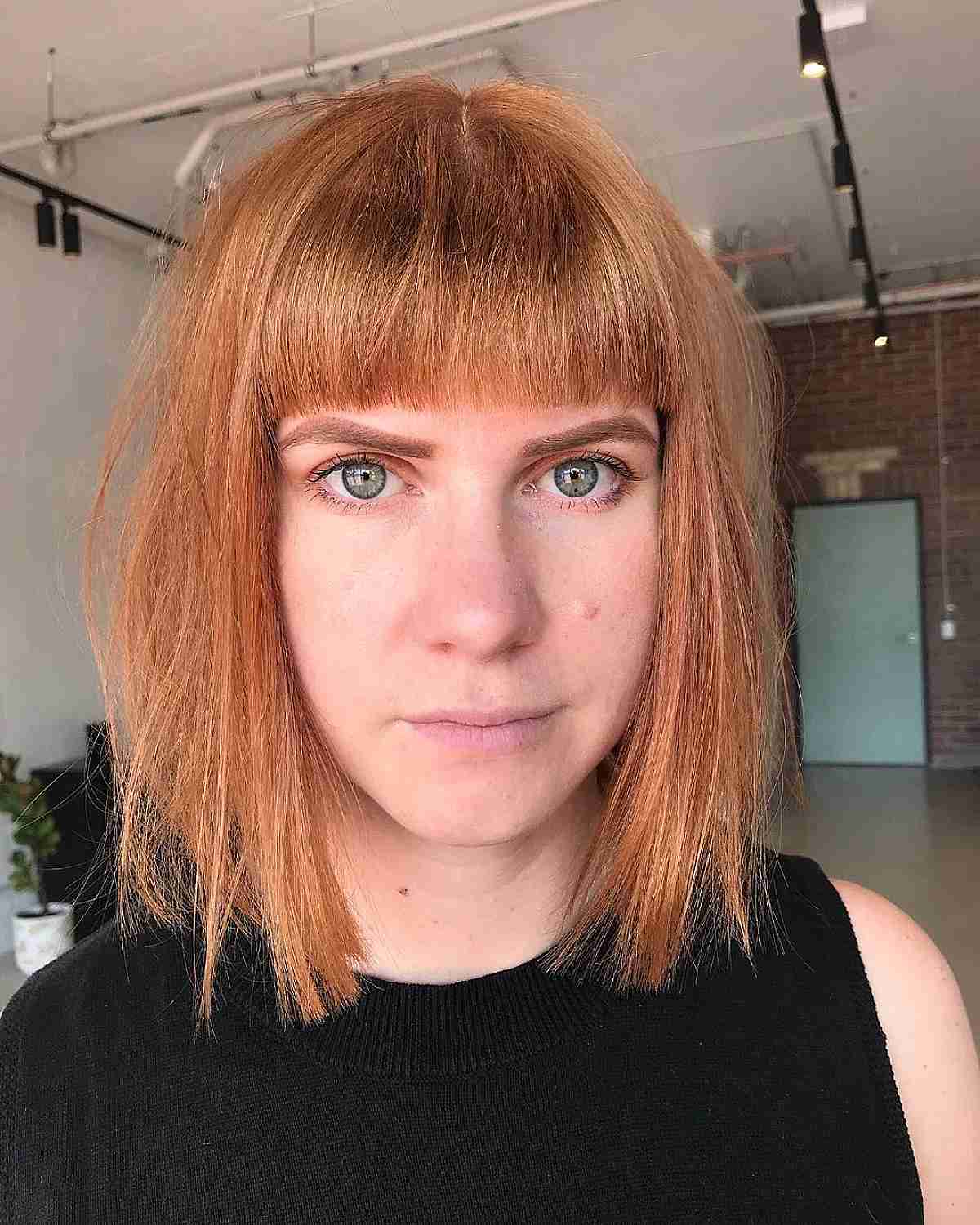 Chic Blunt Bob and Bangs with Tousled Straight Texture