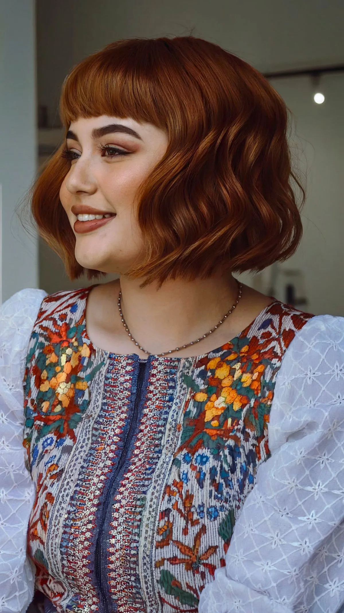 Chic Blunt Bob with Bangs for Fine Hair and Round Faces