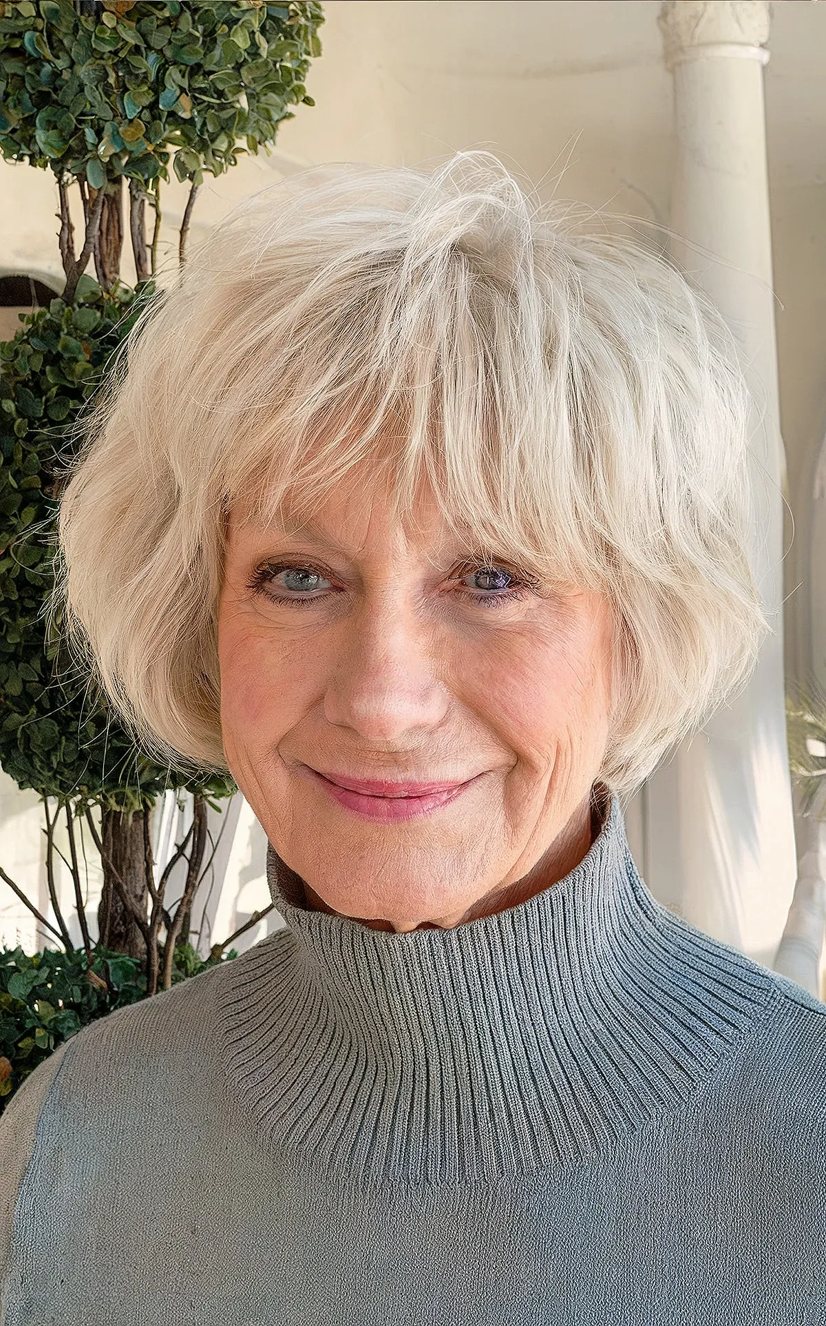 Chic Bob Haircuts with Bangs and Textured Layers for senior ladies with white hair