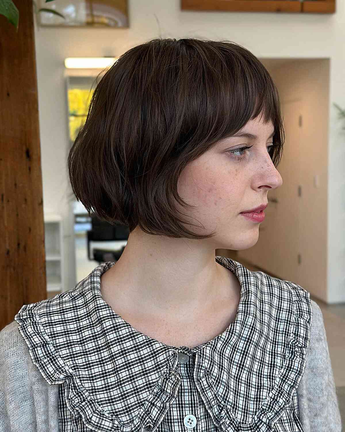 Stylish Brunette Short French Bob with Bottleneck Bangs