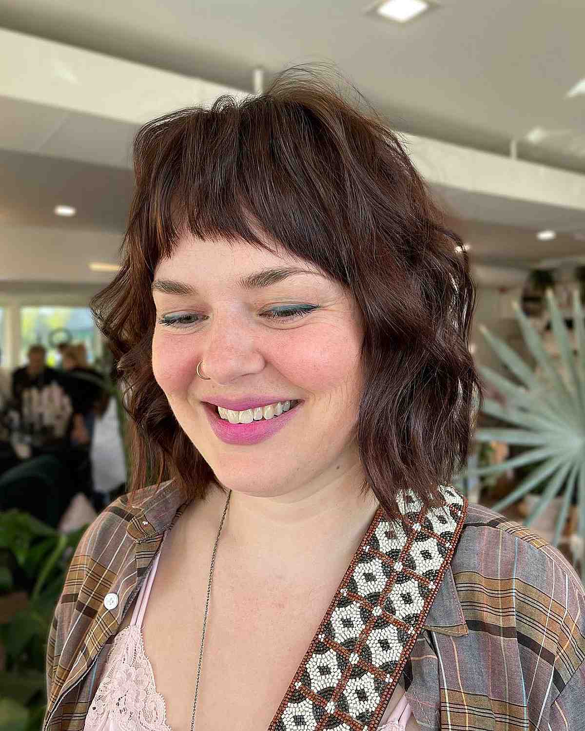 Elegant Brunette Textured Wavy Bob with Short Arched Bangs