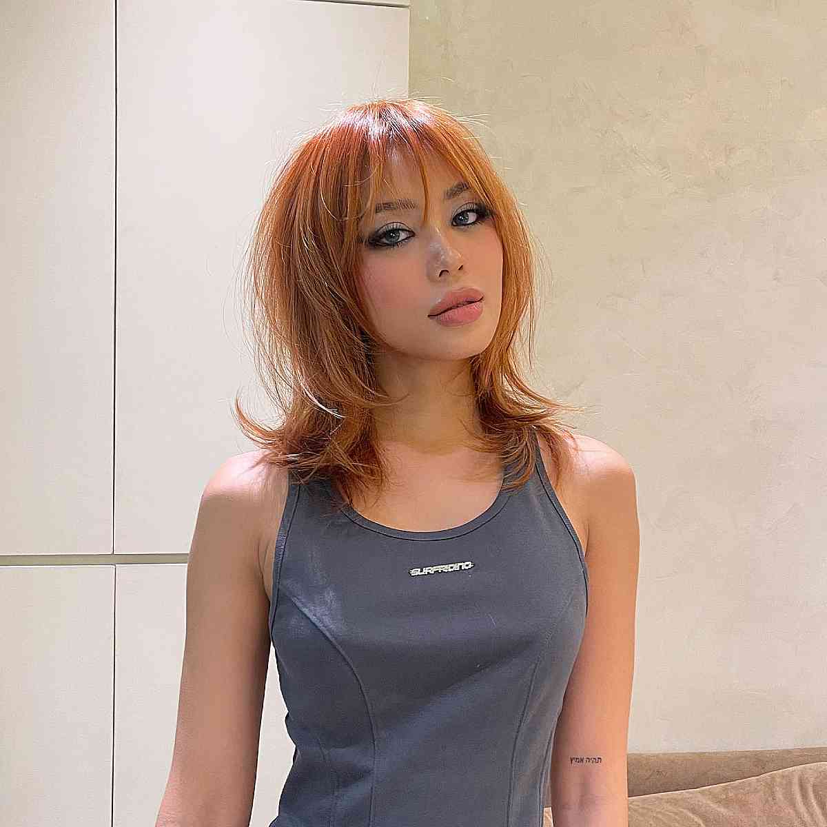 Chic Copper Wolf Cut with Wispy Bangs