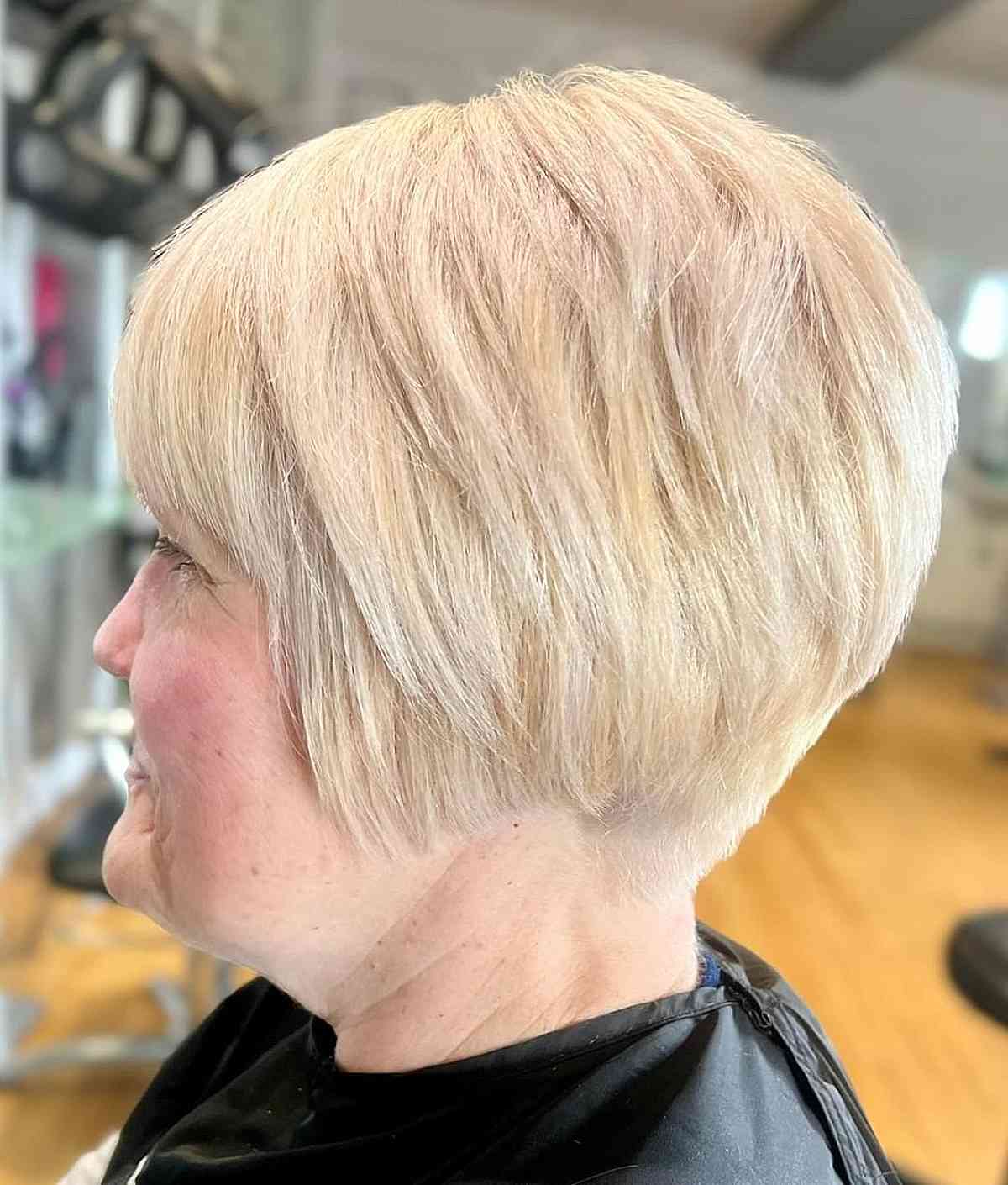 Elegant Ear-Length Pixie Bob with Tapered Nape for 50-Year-Old Women