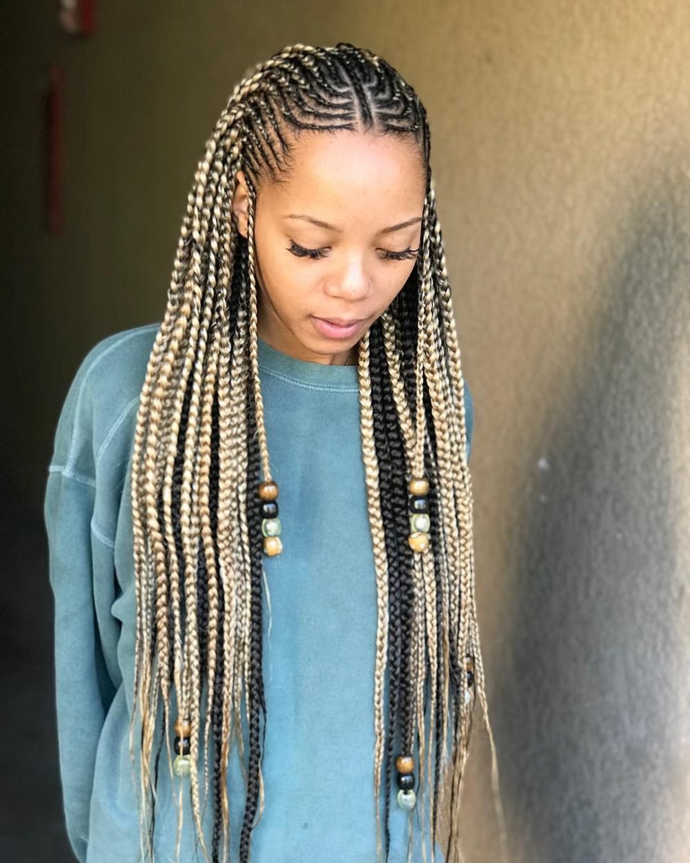 Chic blonde braids adorned with beads and cornrows