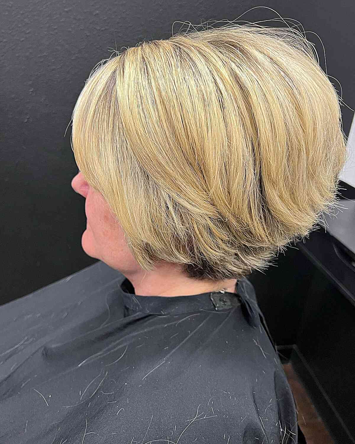 Stylish Blonde Graduated Wedge Bob with Flipped Layers for Older Women
