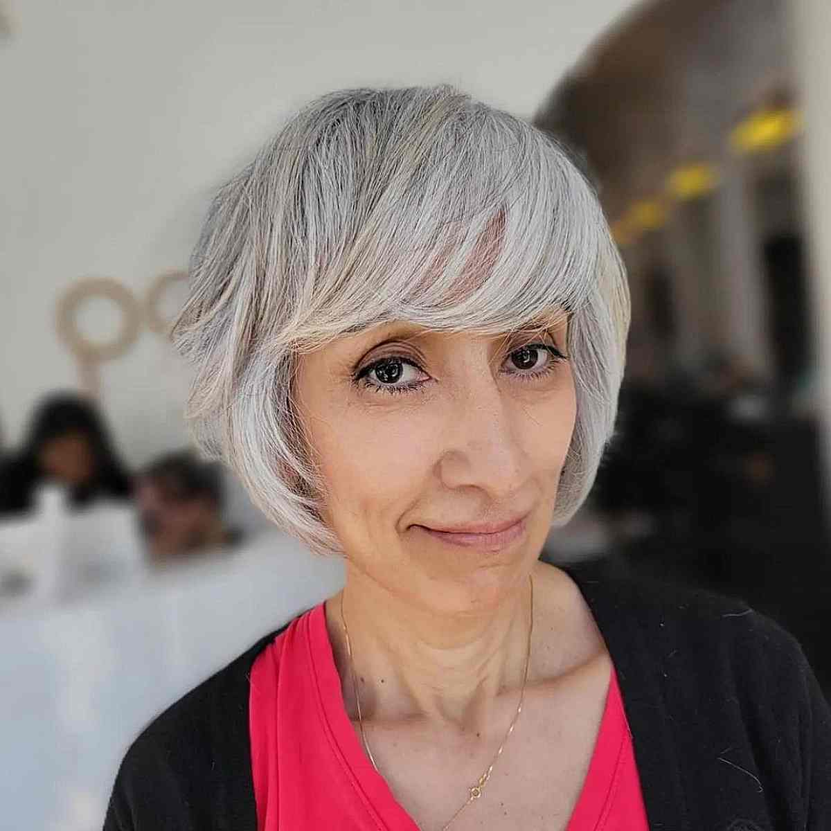 Chic Grey Bob with Full Side-Swept Bangs for 50-Year-Old Ladies with Fine Hair