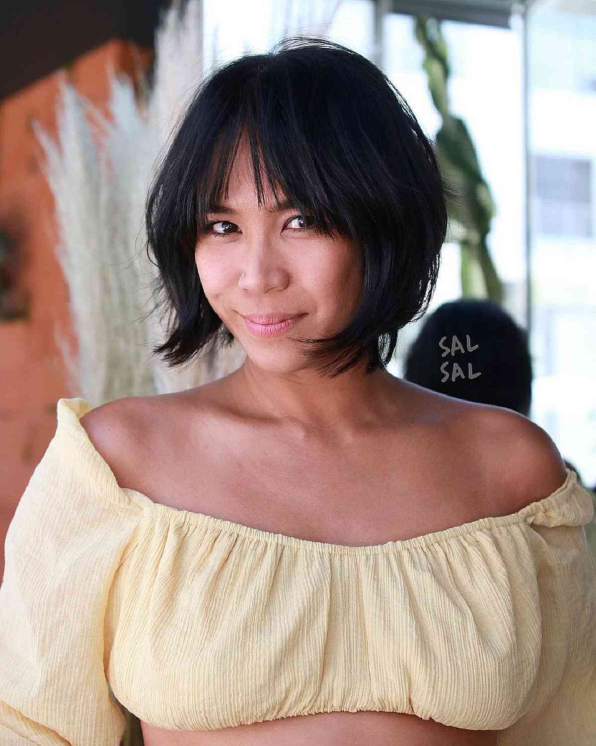 Chic Layered Haircut with Wispy Curtain Bangs