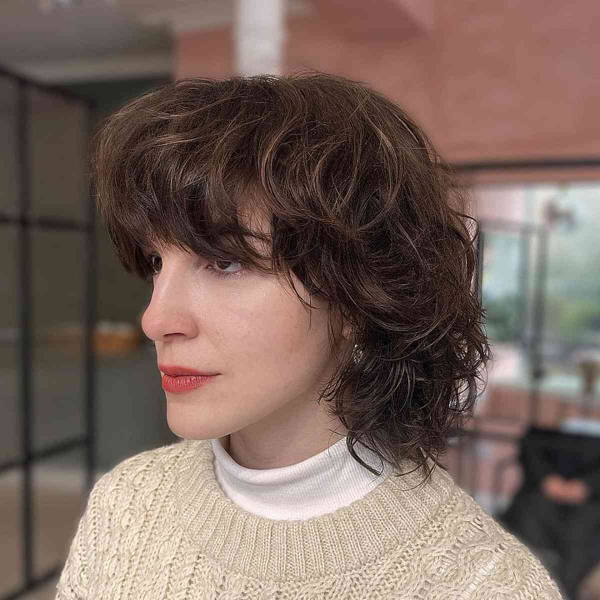 Chic Layered Shag with Bangs for Oval Face Shapes with Thick Wavy Hair