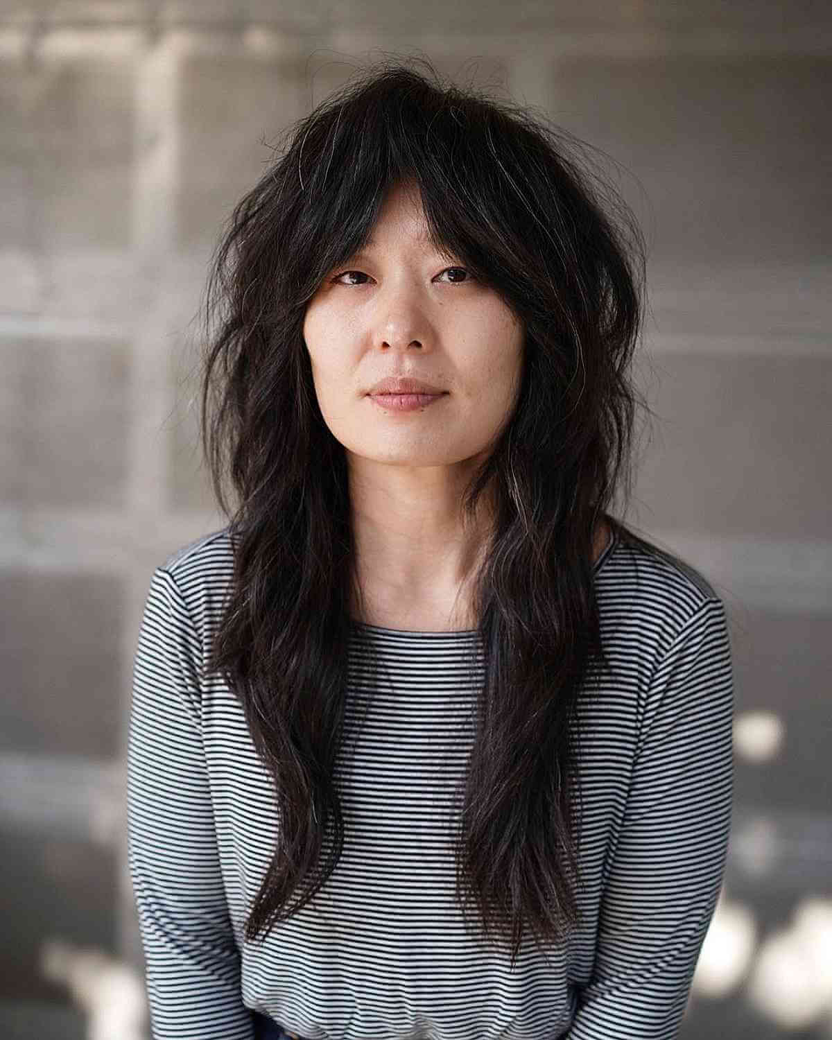 Chic Long Choppy Shag with Curtain Bangs for Stylish Women Over 40