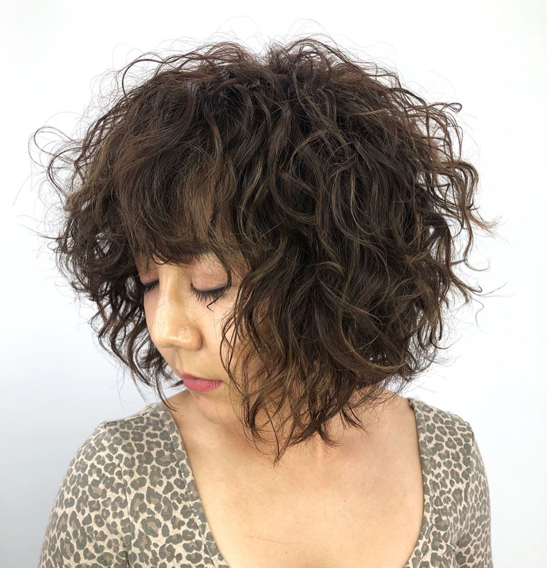 chic messy short curly bob haircut for asian girl